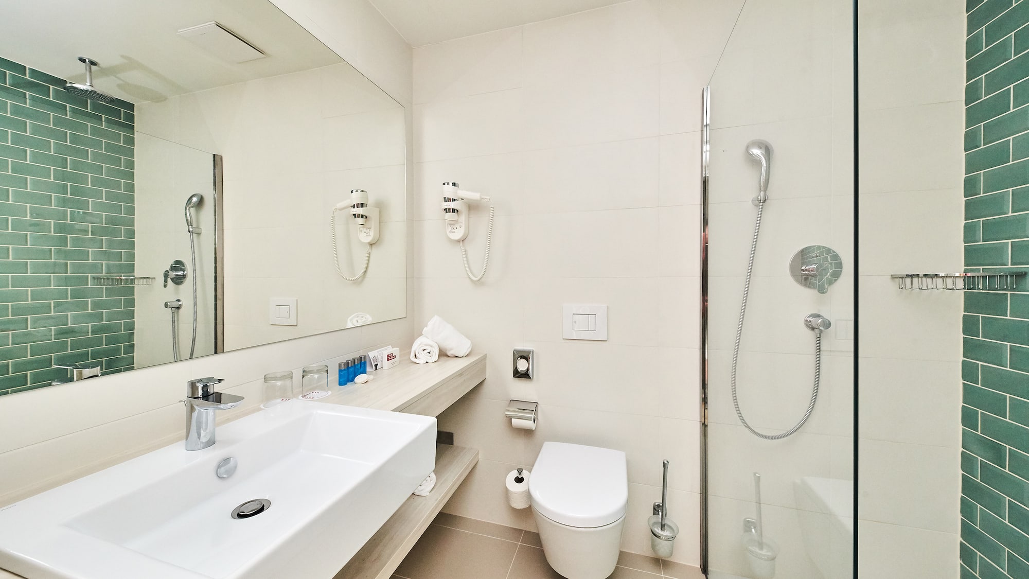 a bathroom with a shower and sink