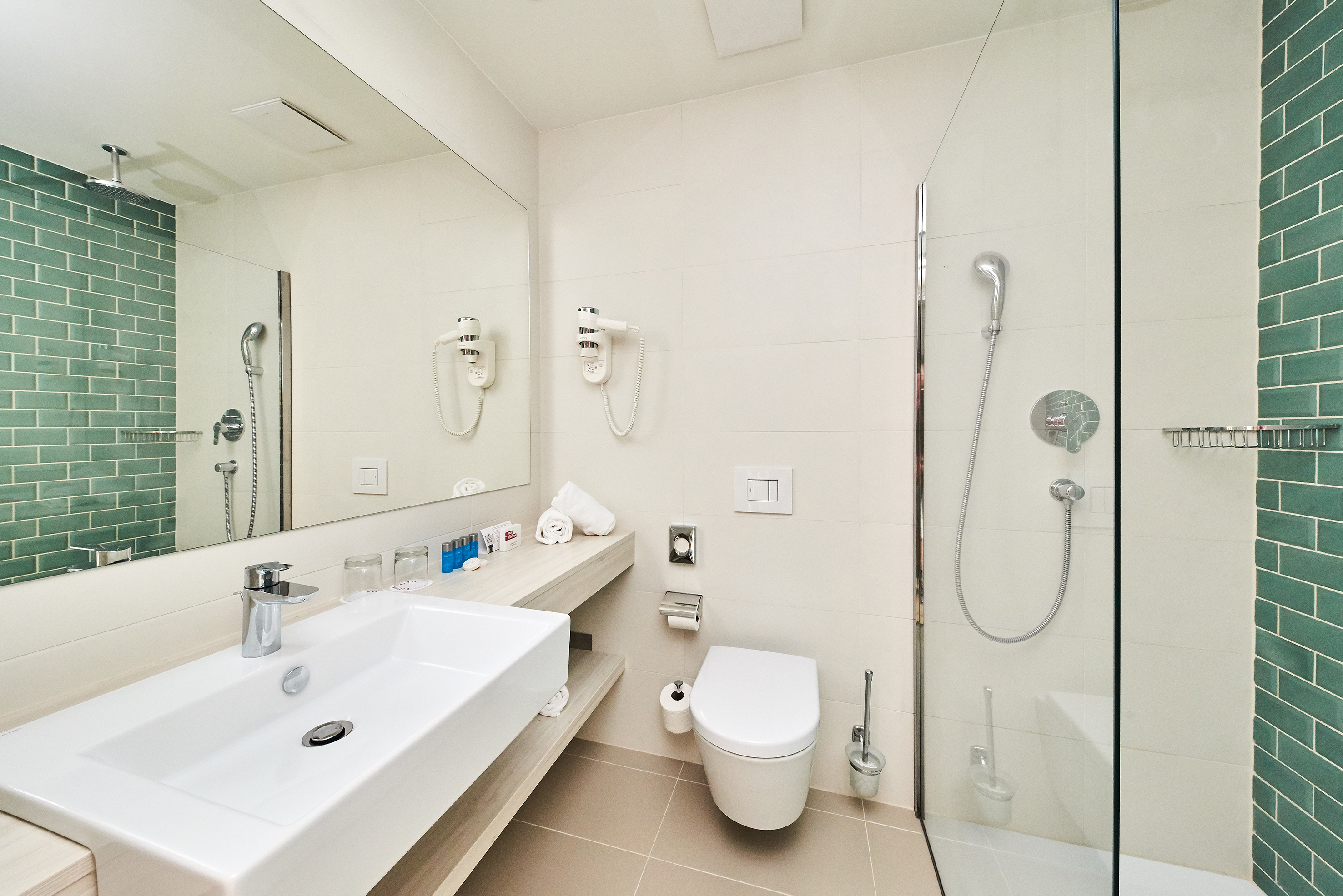 a bathroom with a shower and sink
