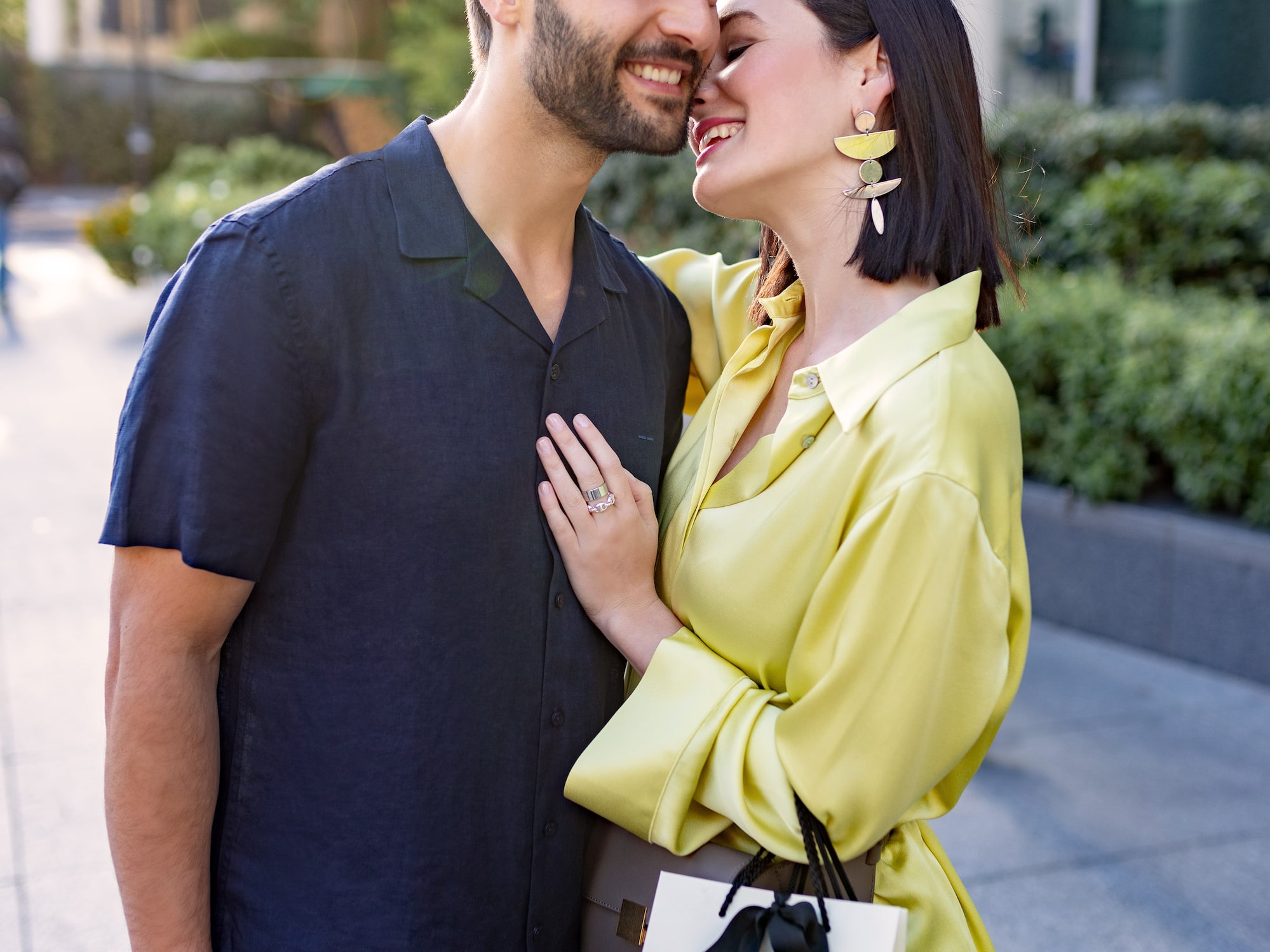 a man and woman hugging and smiling