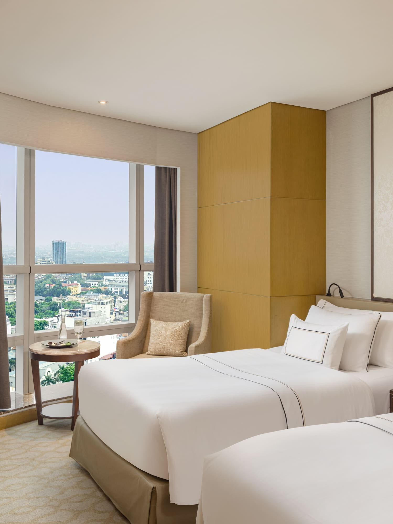 a room with two beds and a window