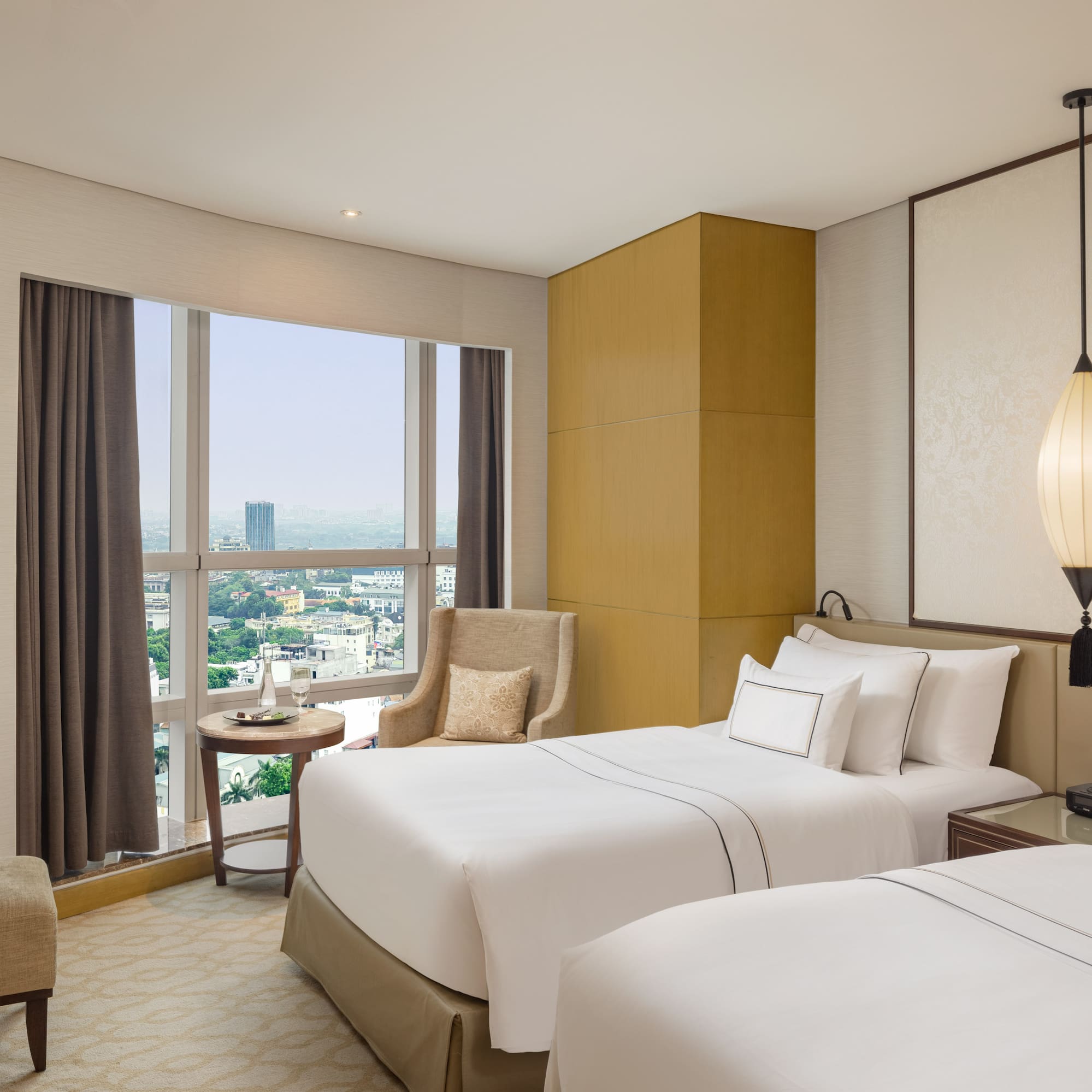 a room with two beds and a window