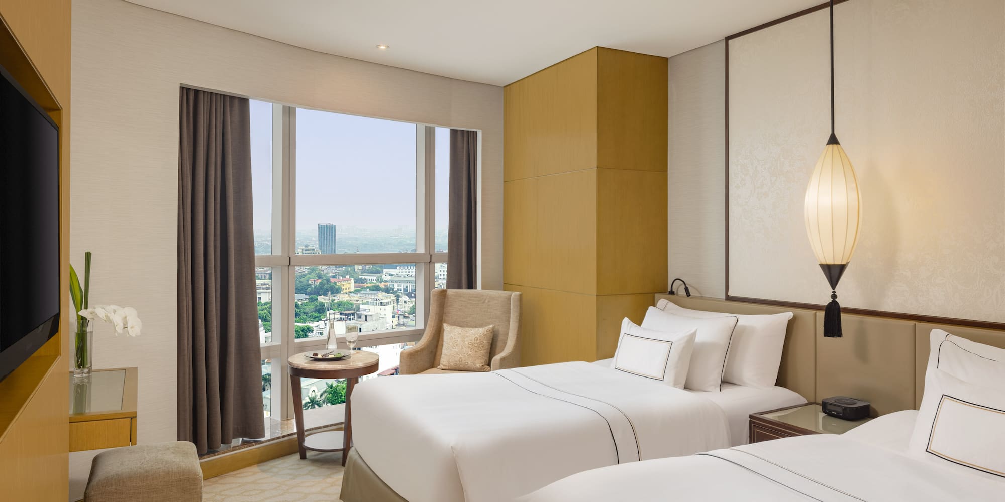 a room with two beds and a window