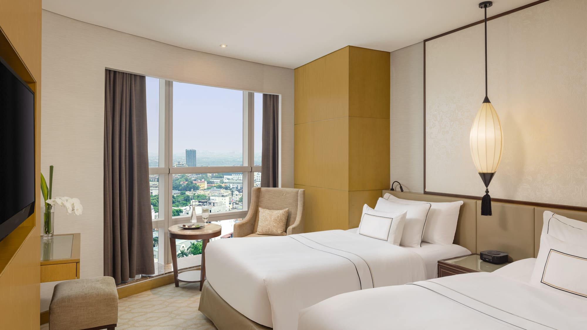 a room with two beds and a window