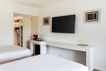 a room with a television on the wall