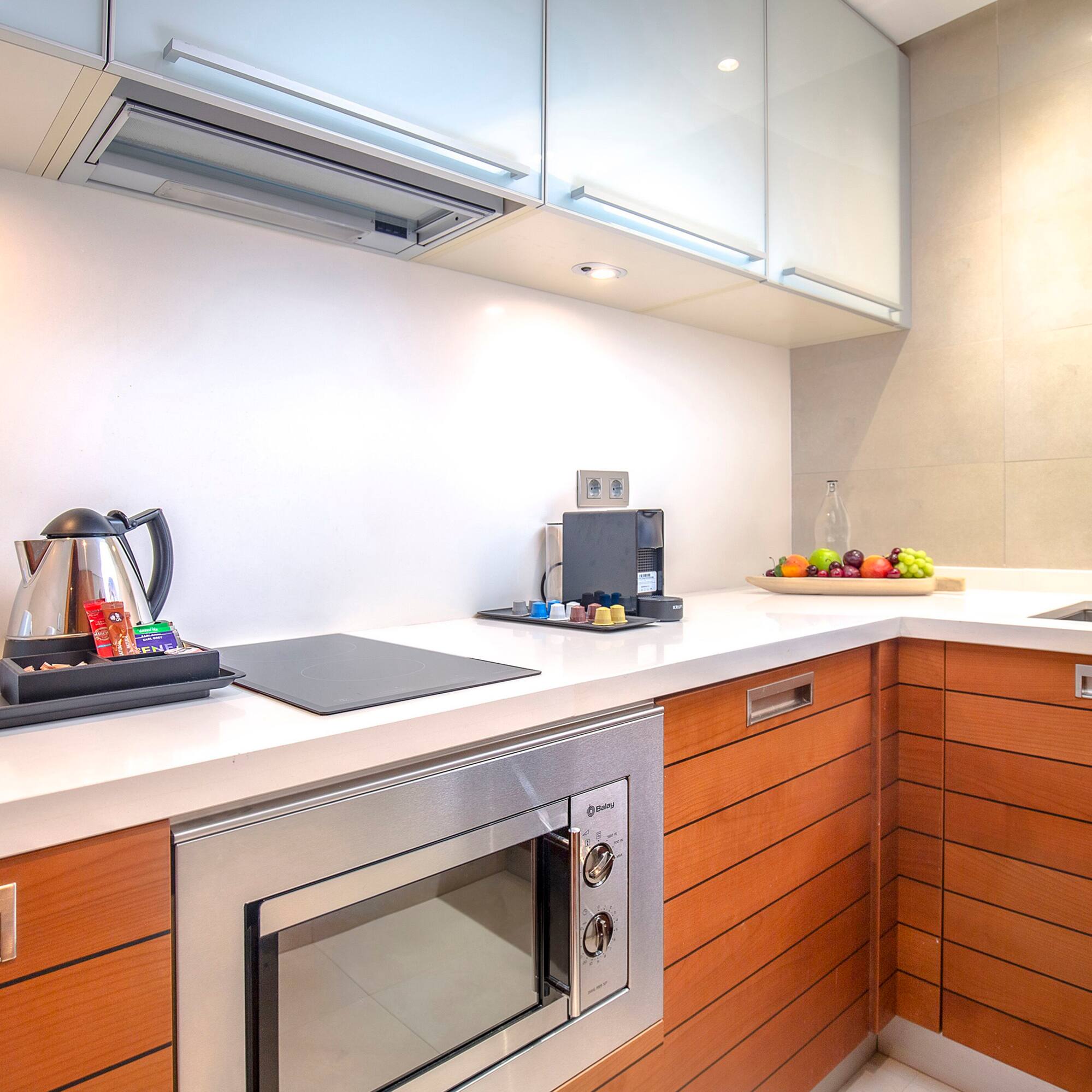 a kitchen with wood cabinets and a stove