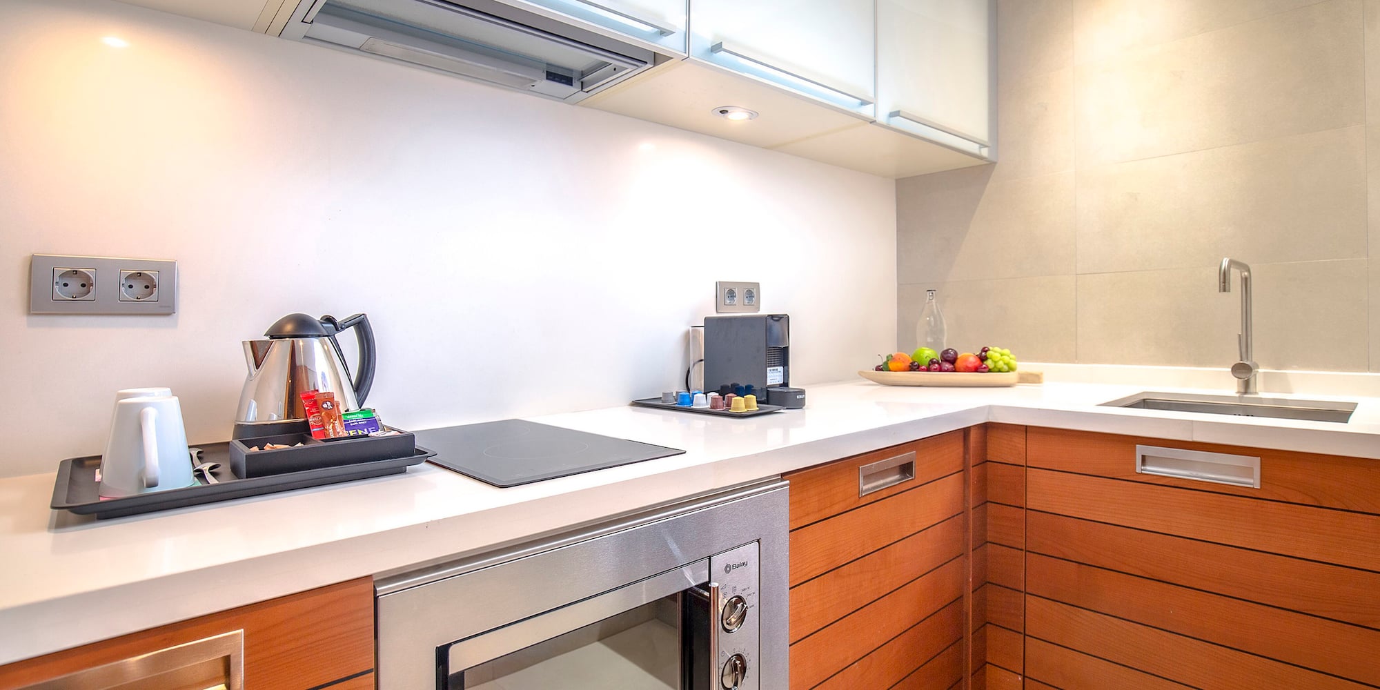 a kitchen with wood cabinets and a stove