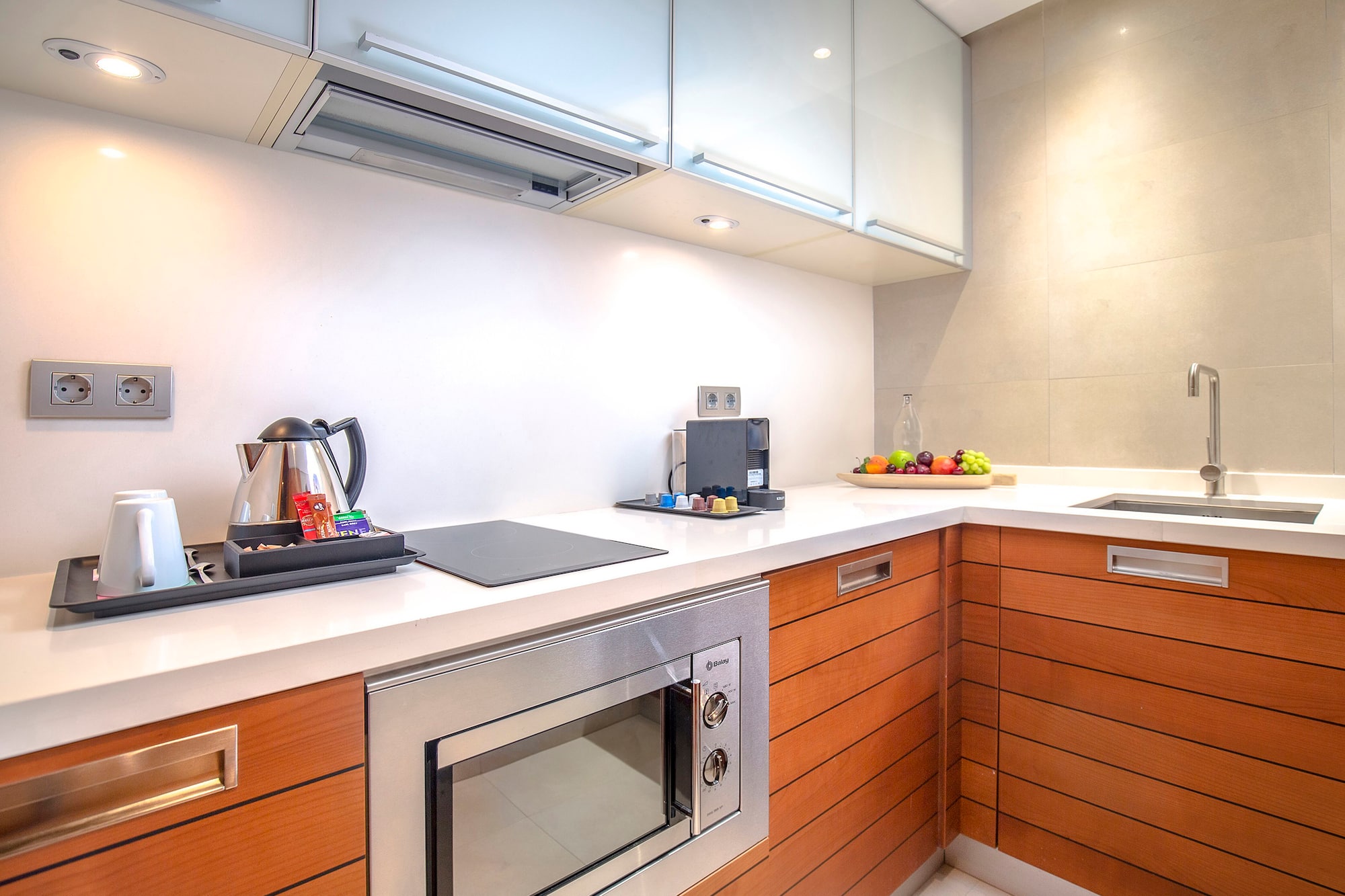 a kitchen with wood cabinets and a stove