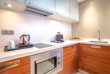 a kitchen with wood cabinets and a stove