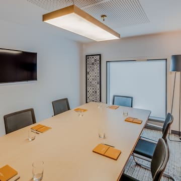 a room with a table and chairs