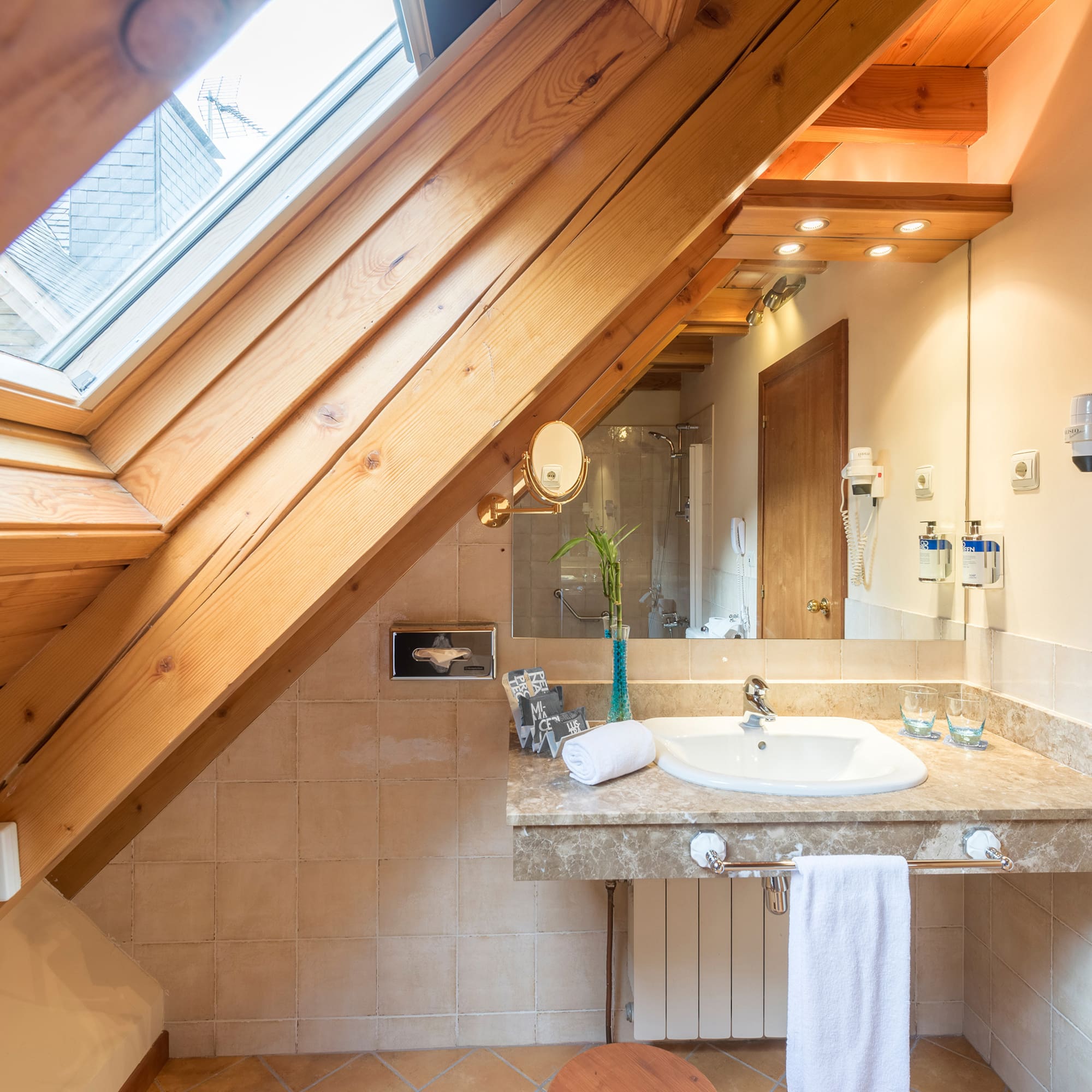 a bathroom with a wooden ceiling and a sink