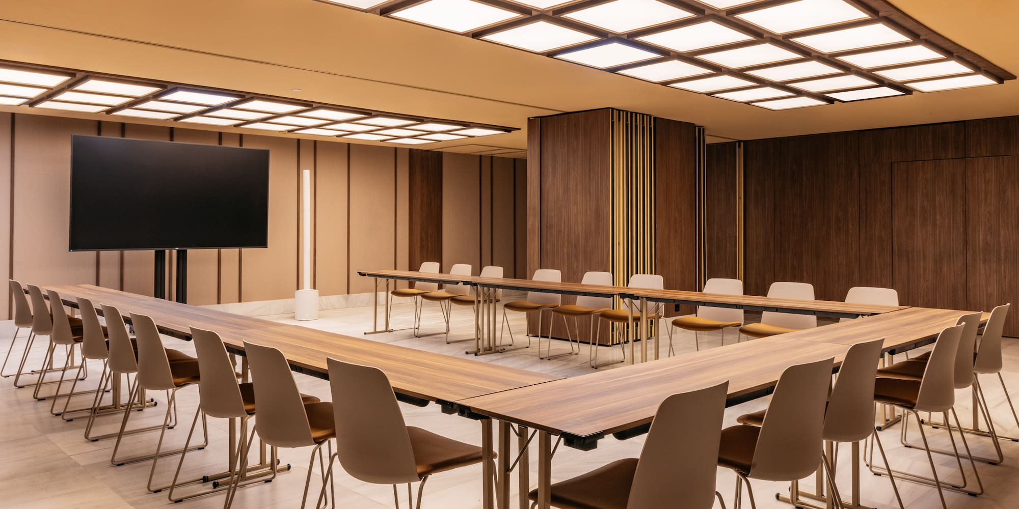 a room with a large table and chairs