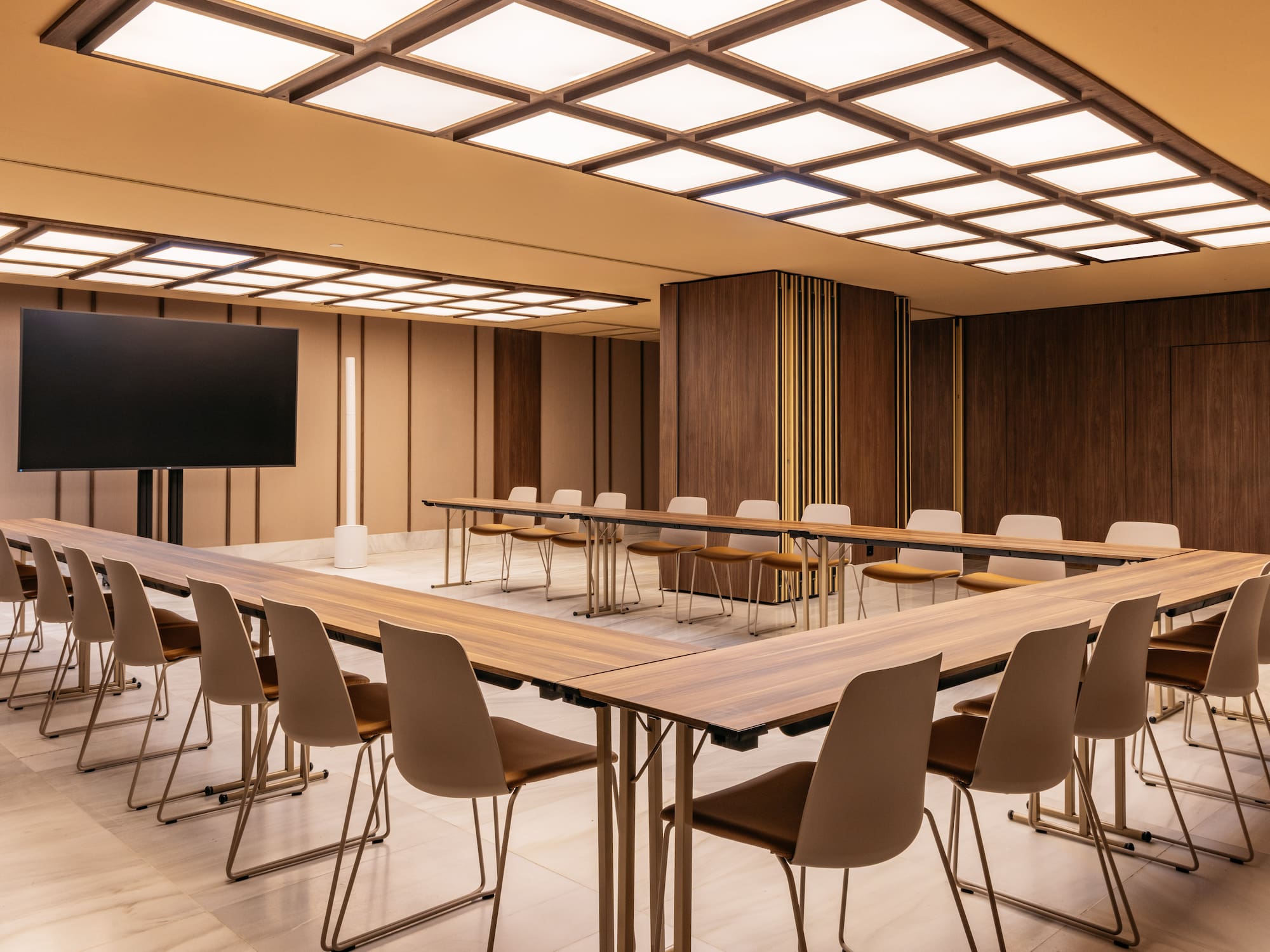 a room with a large table and chairs