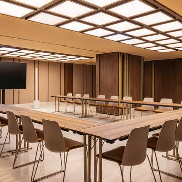 a room with a large table and chairs