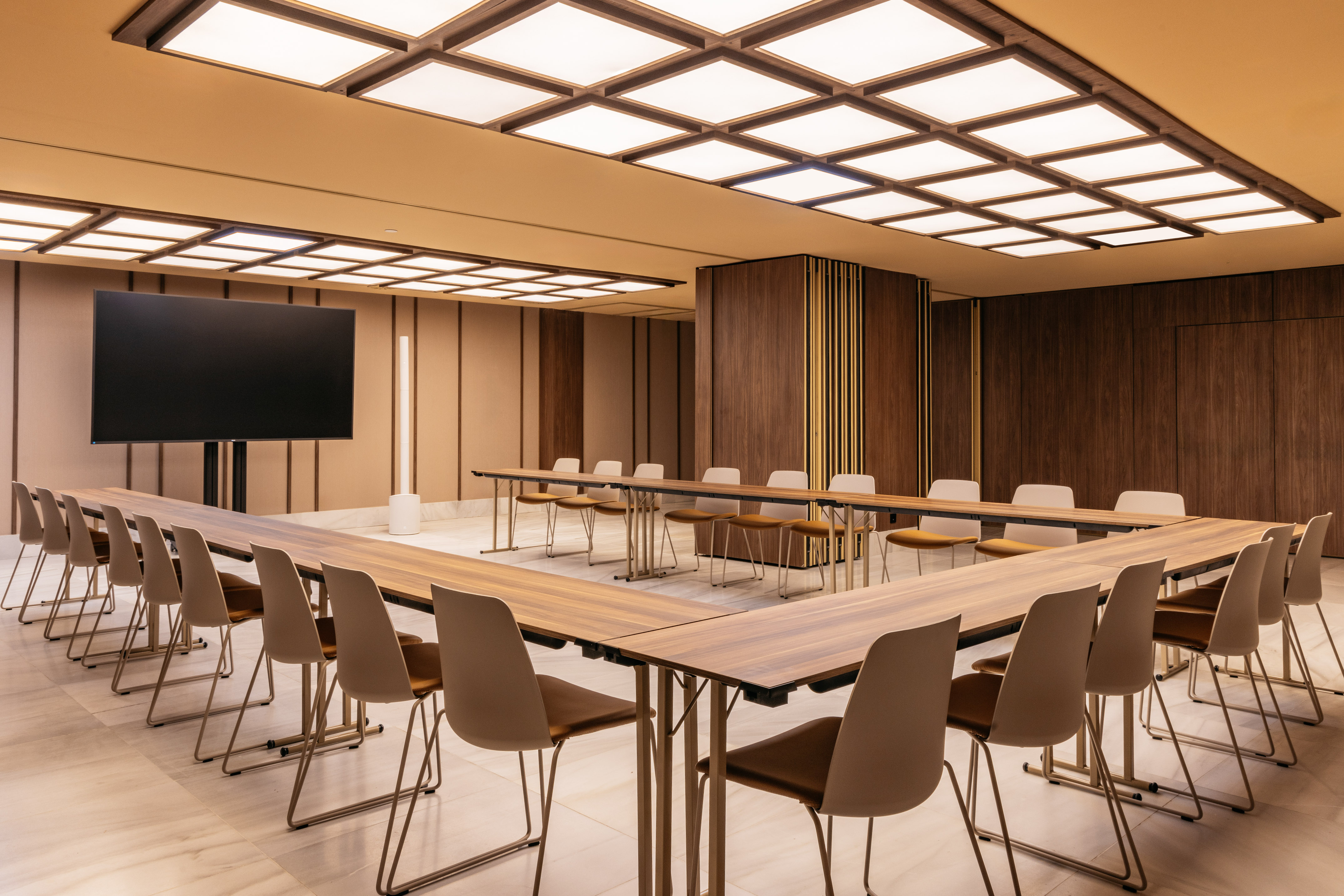 a room with a large table and chairs