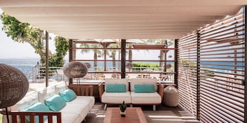 a patio with a couch and a table