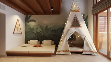 a room with a teepee bed and a bed and a bed