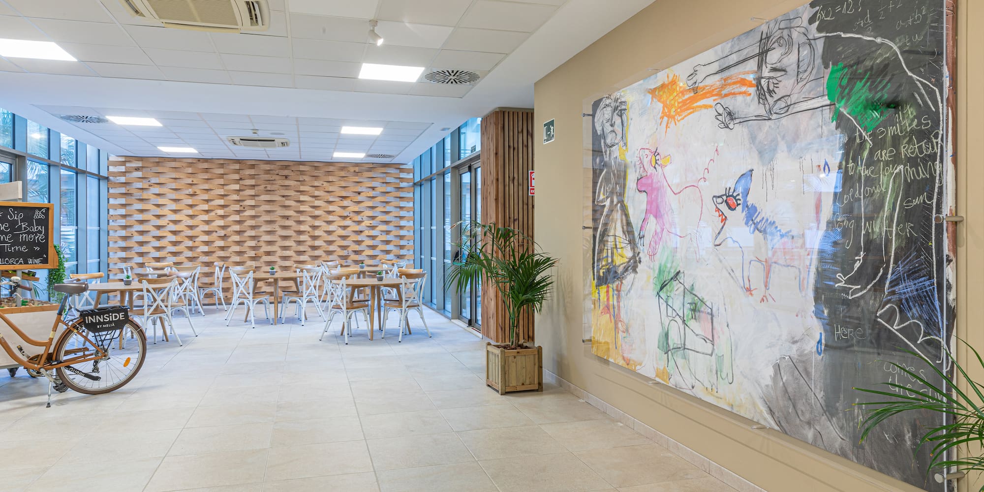 a room with a large painting on the wall