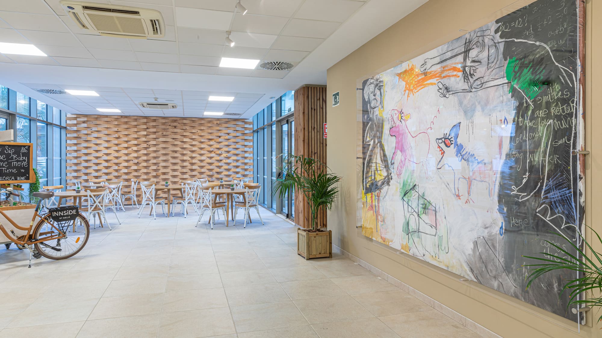 a room with a large painting on the wall