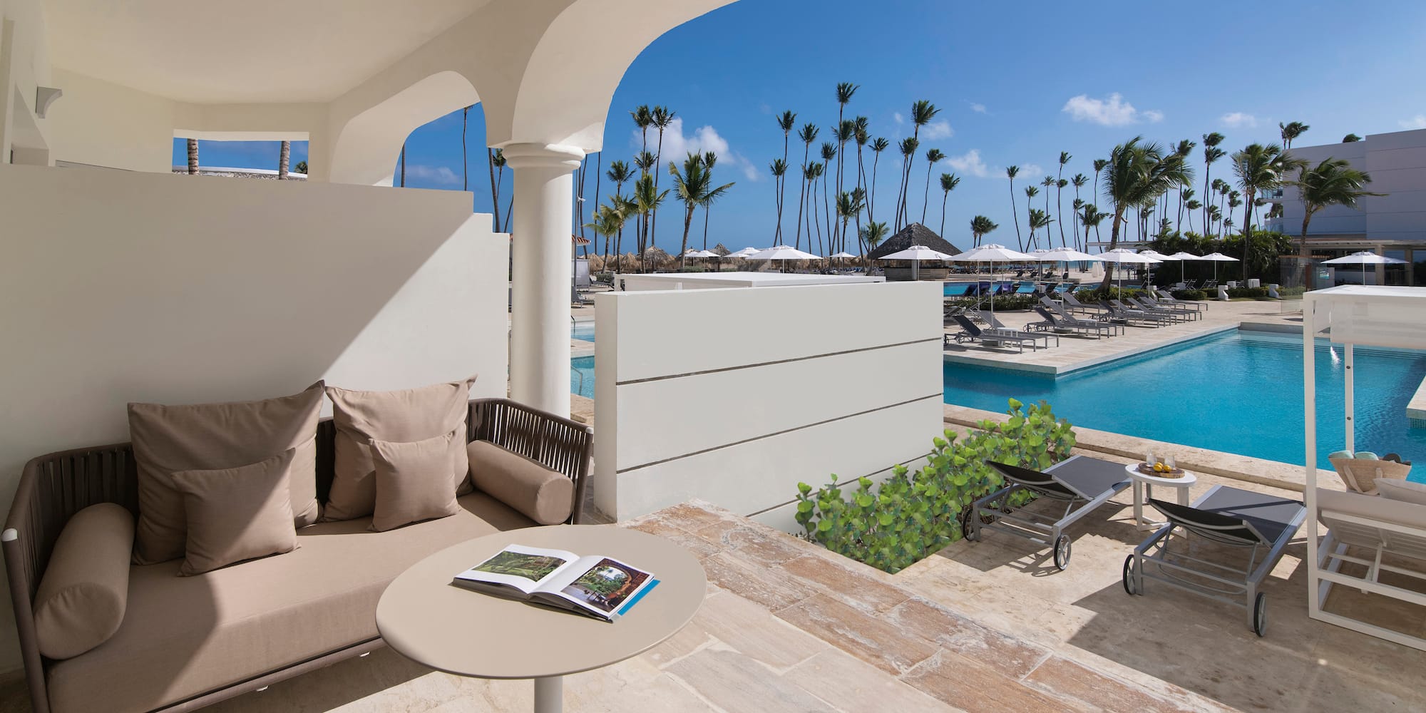 a pool with a couch and a table