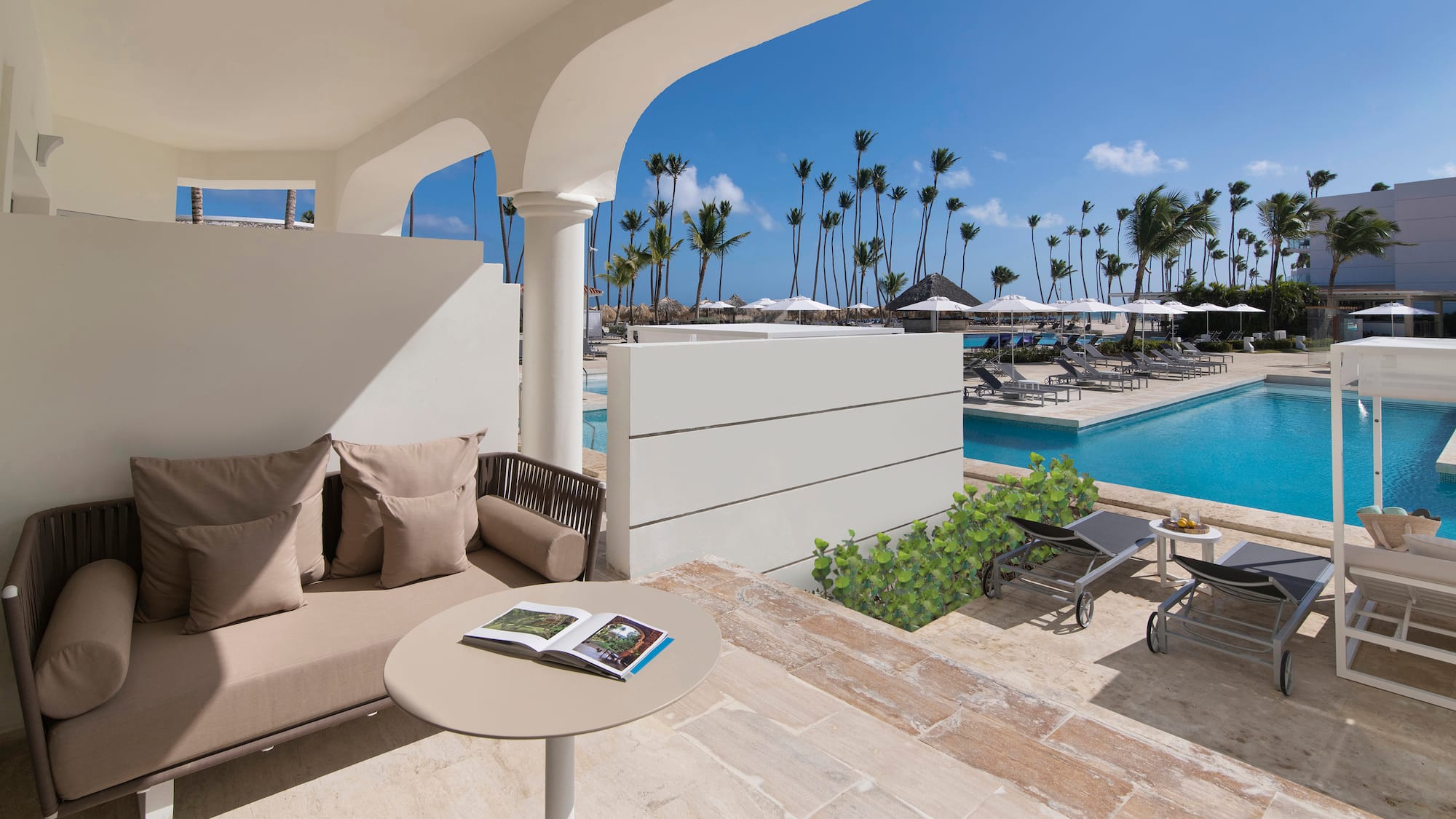 a pool with a couch and a table