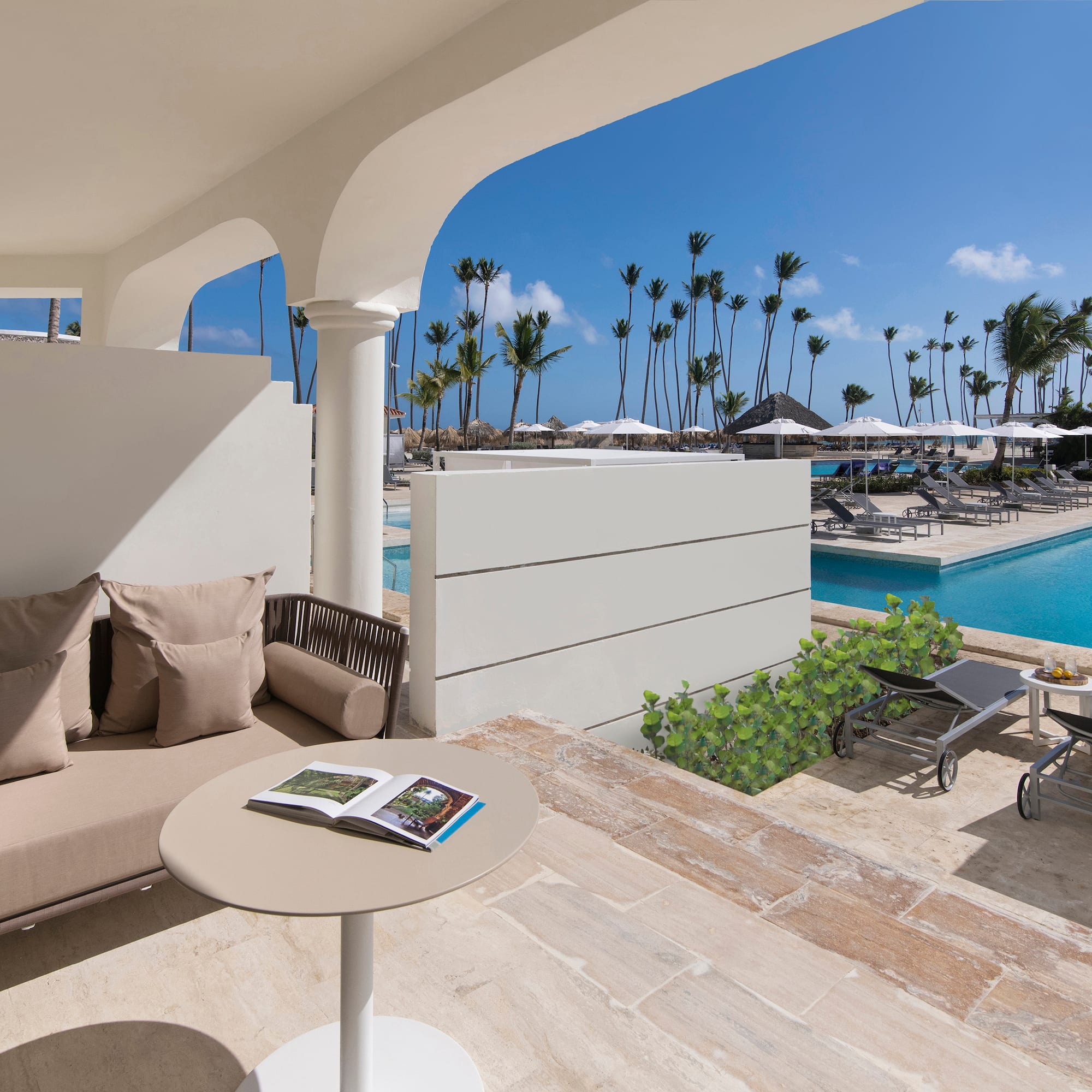 a pool with a couch and a table