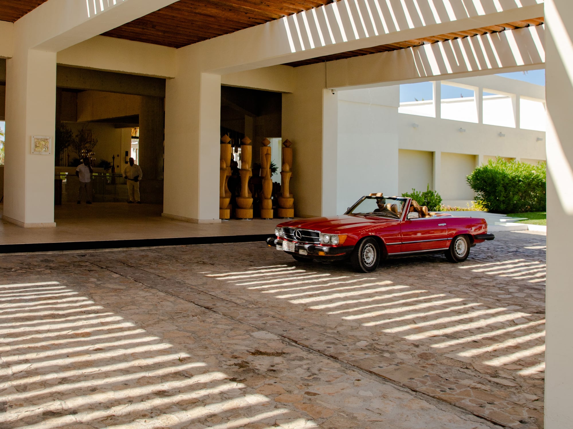 a red car parked in a parking lot