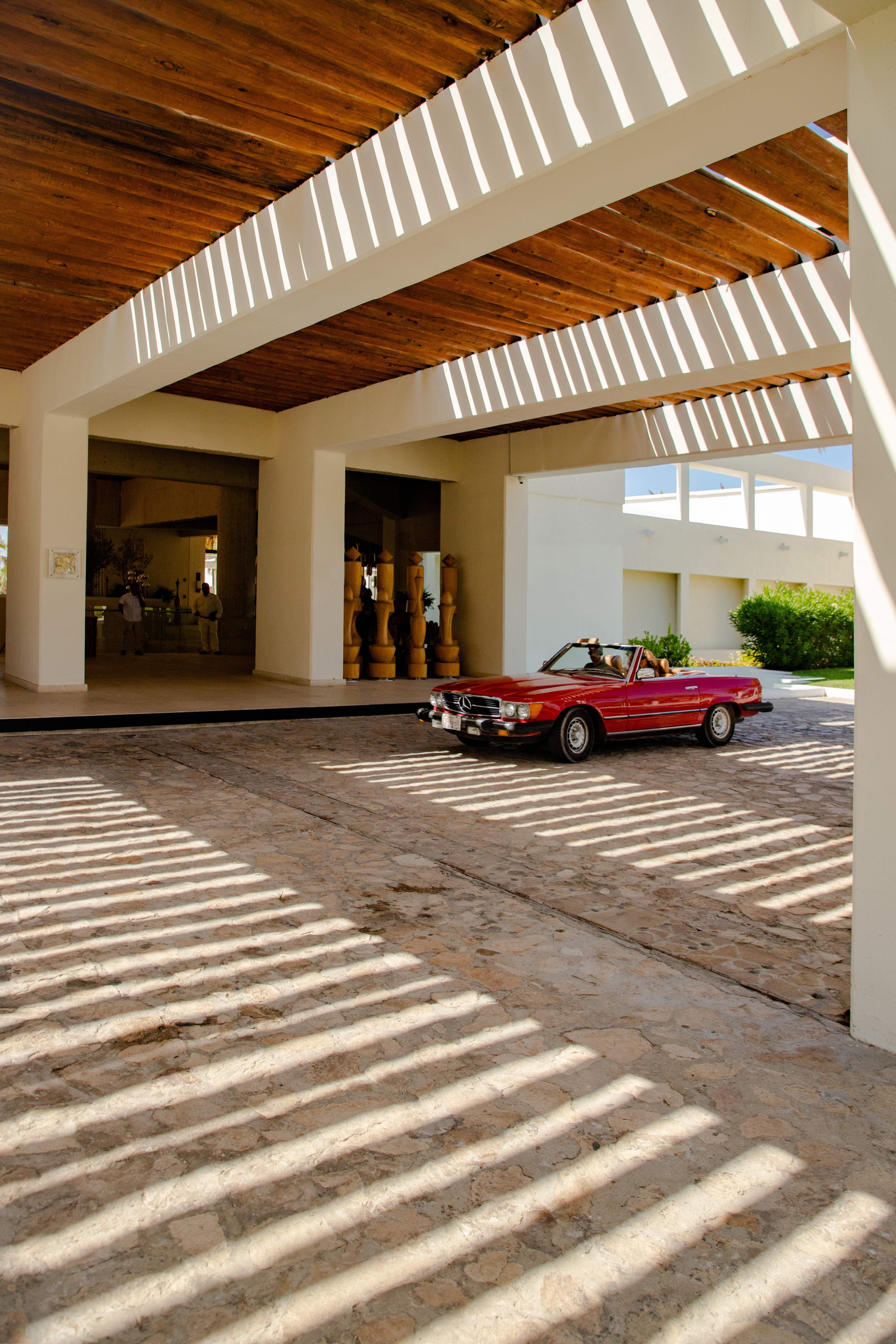 a red car parked in a parking lot