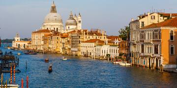 a water way with buildings and boats on it