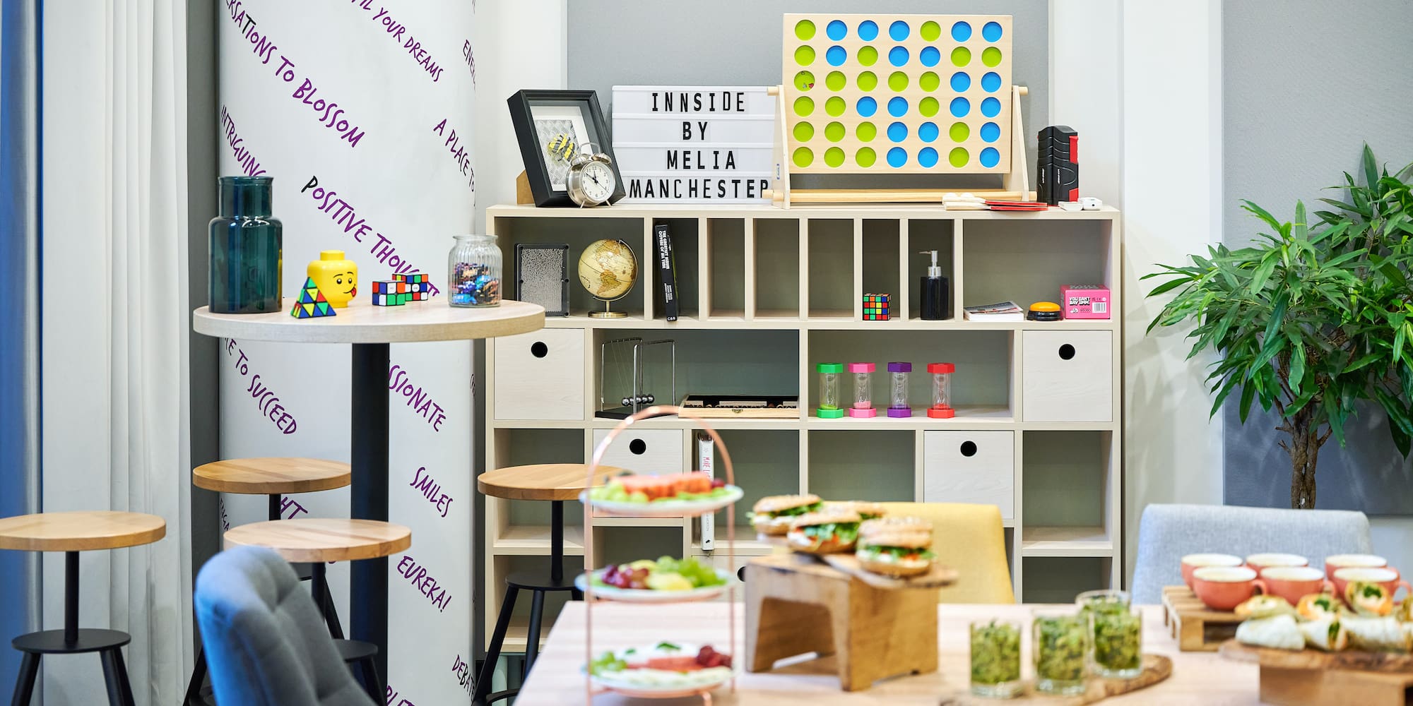 a room with a table and chairs and a board game
