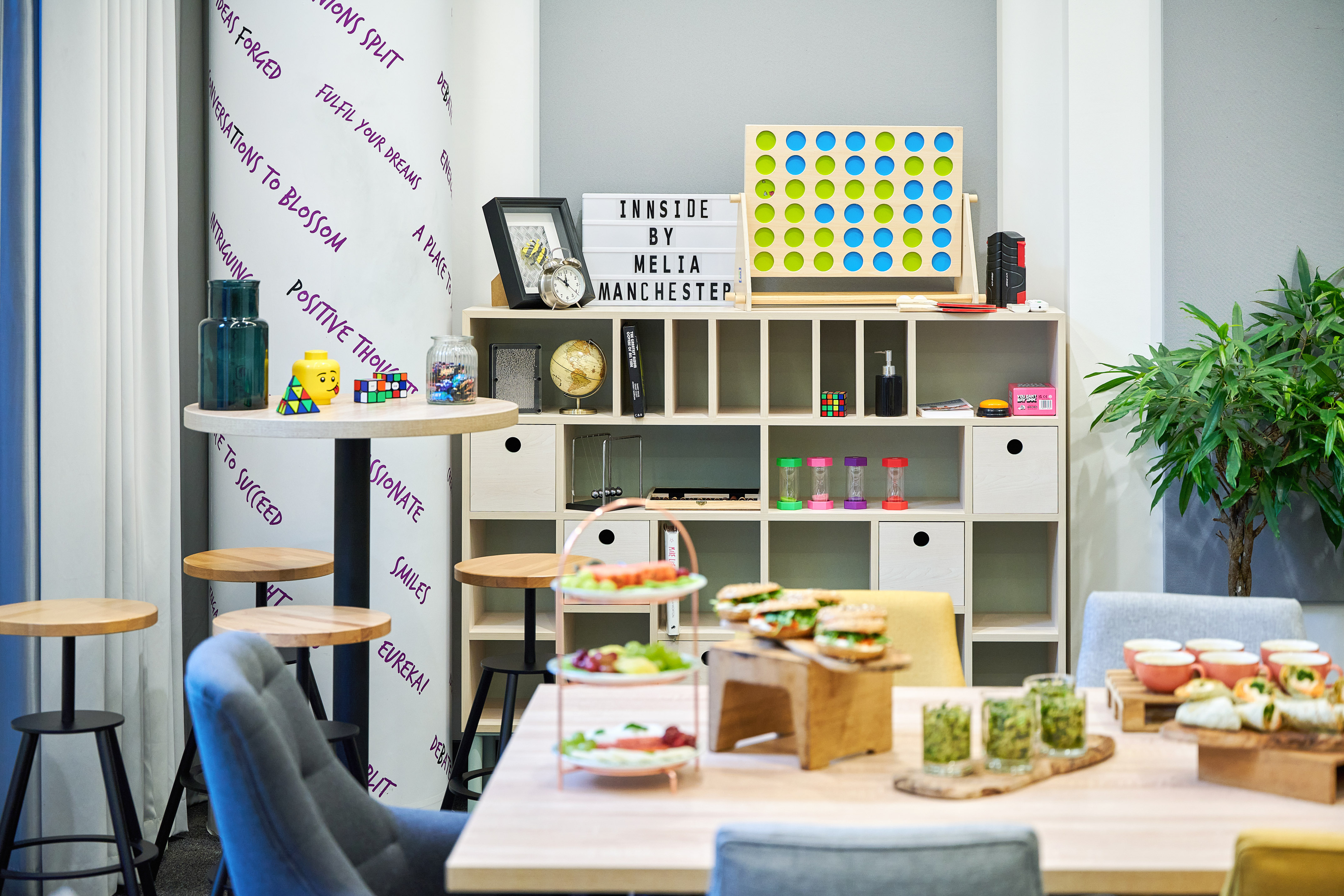 a room with a table and chairs and a board game