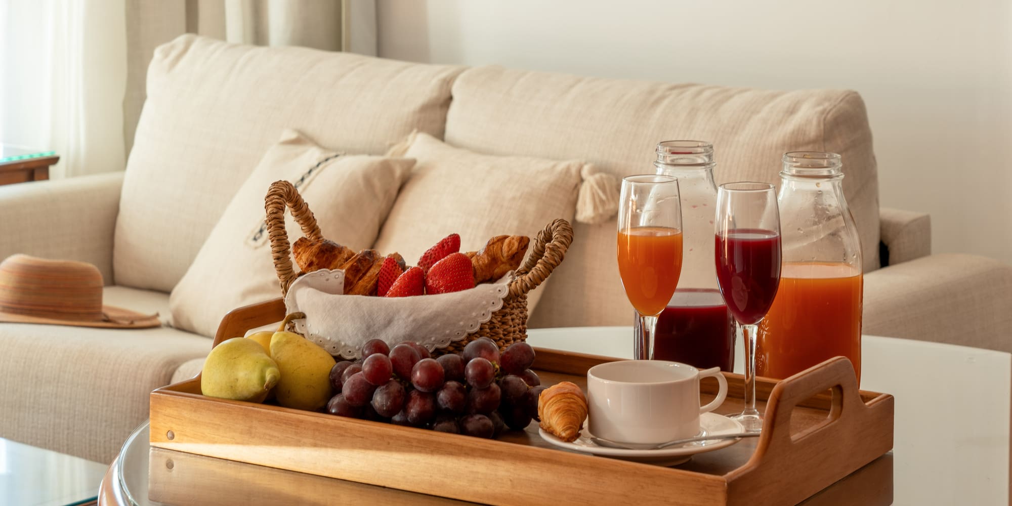 a tray of fruit and drinks on a table