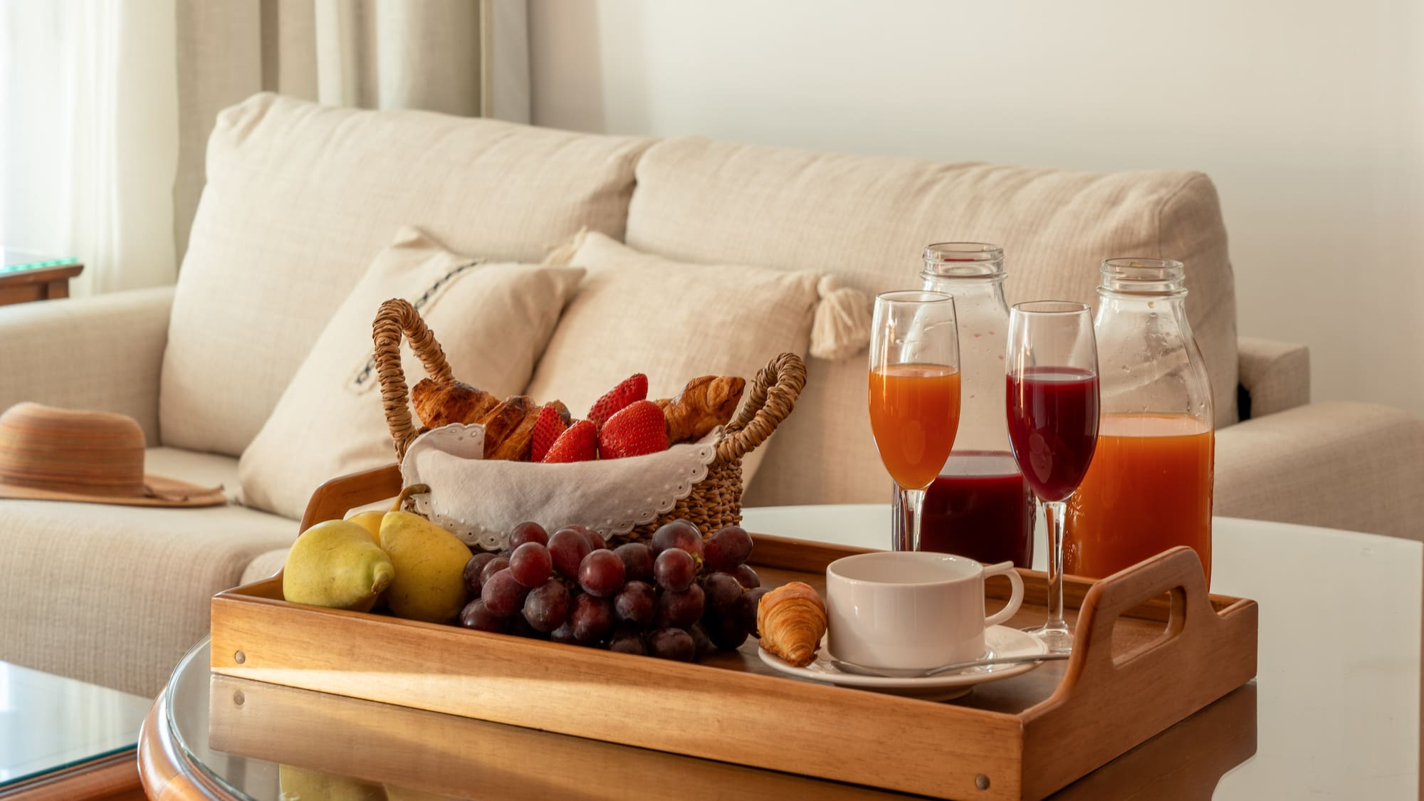 a tray of fruit and drinks on a table