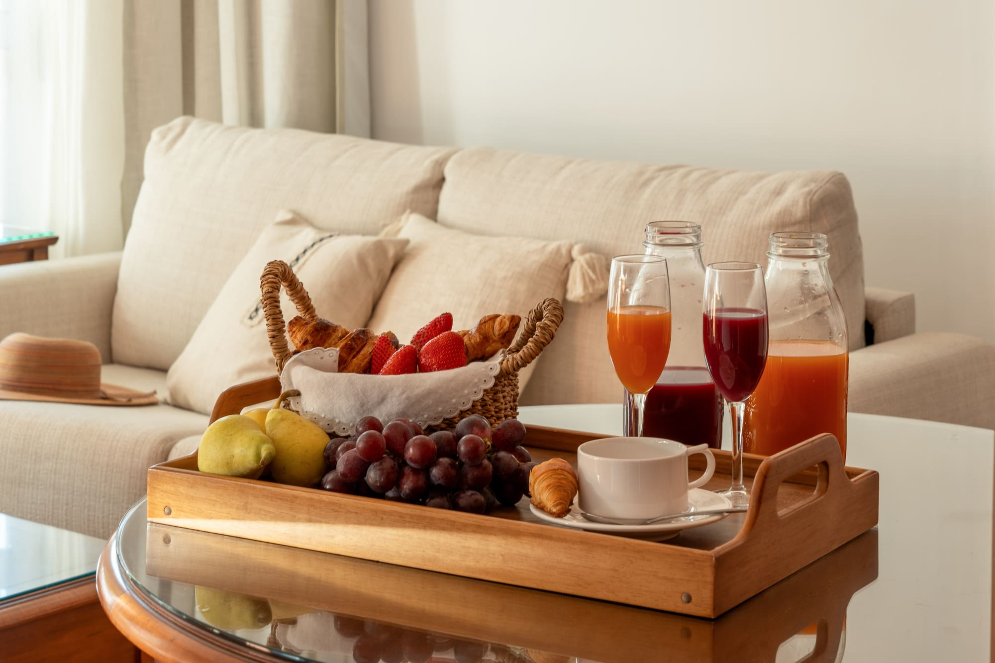 a tray of fruit and drinks on a table