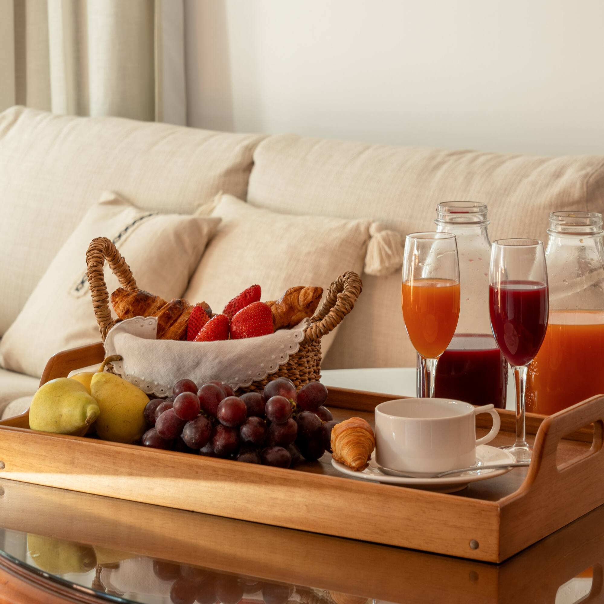 a tray of fruit and drinks on a table