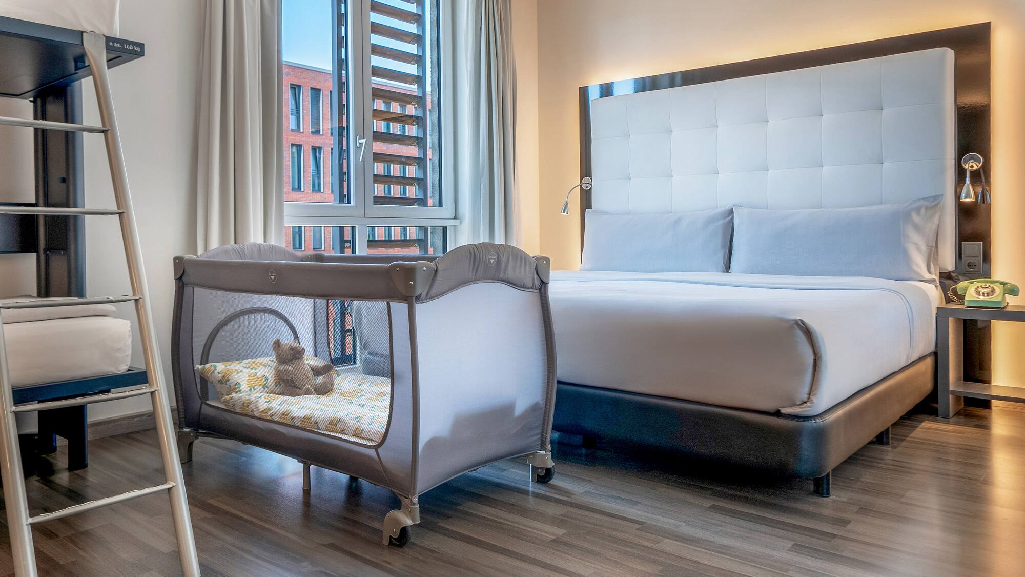 a bed and crib in a room