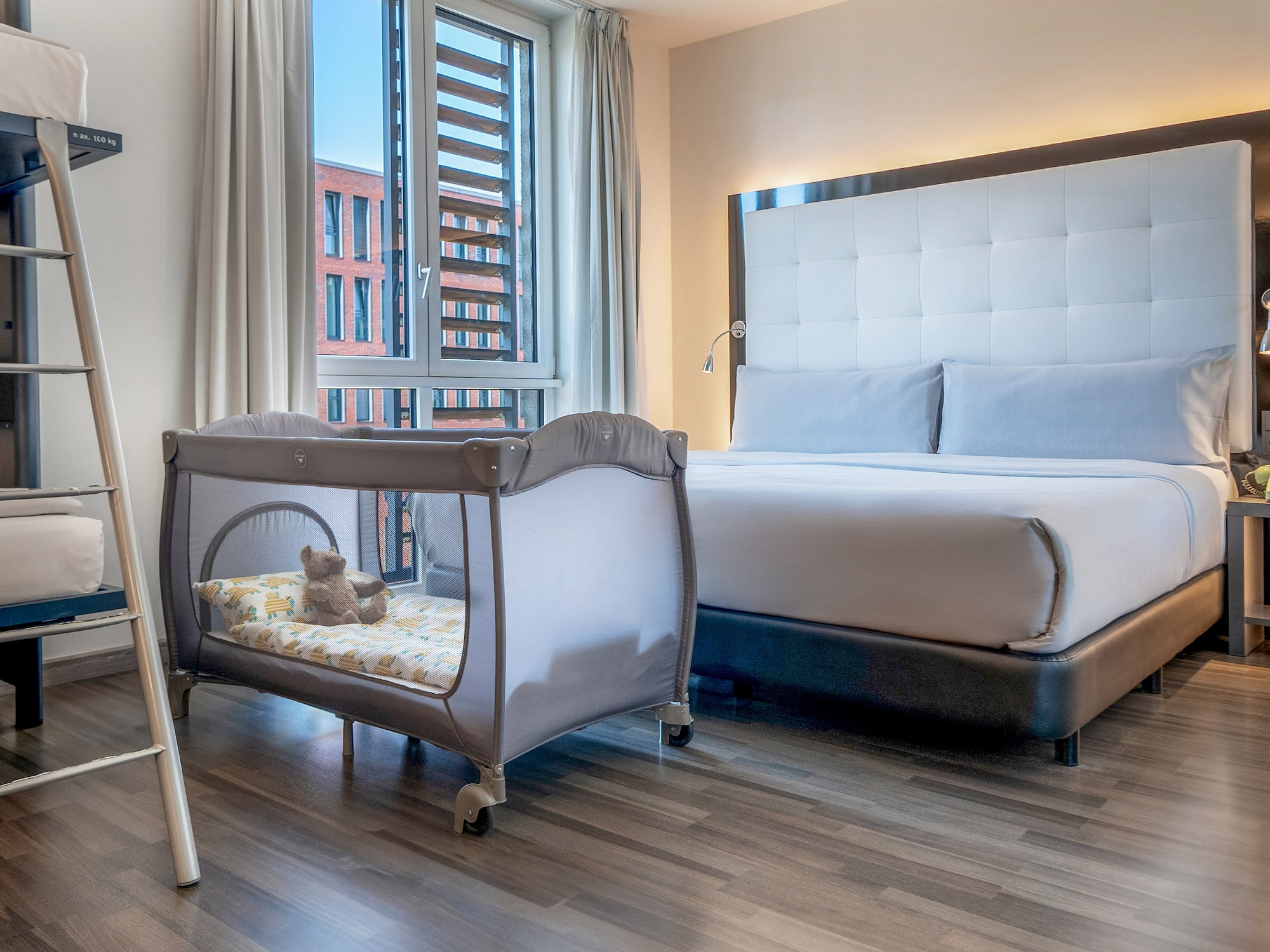 a bed and crib in a room