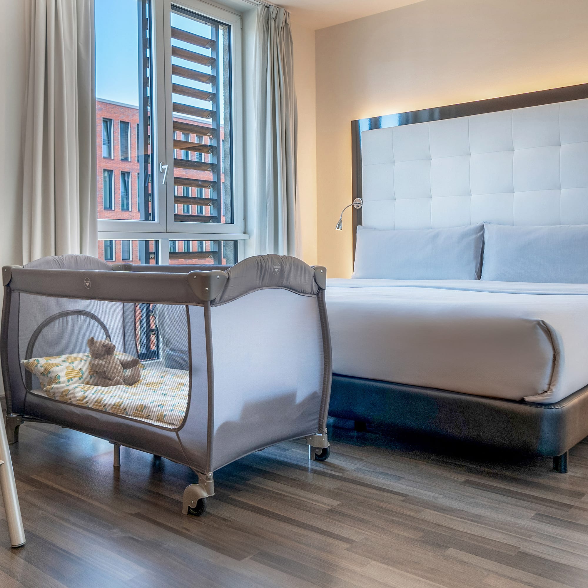 a bed and crib in a room