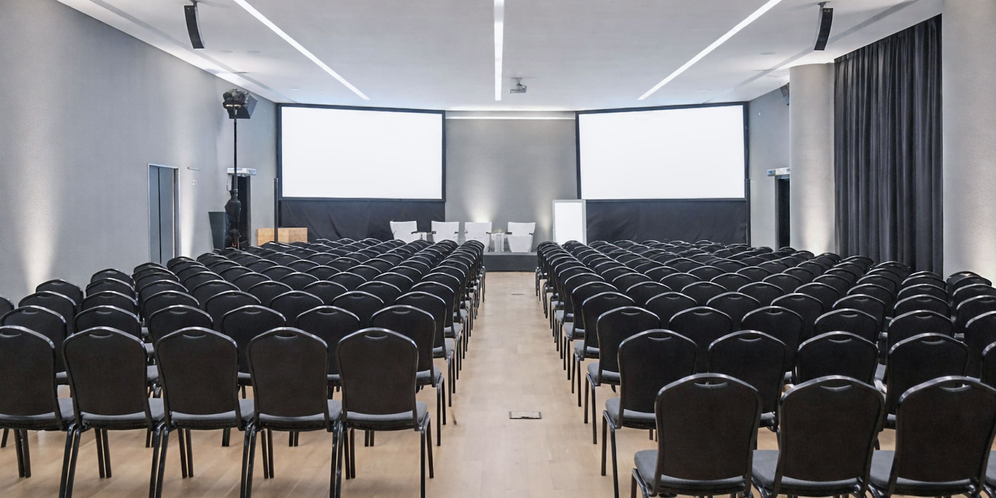 a large room with rows of chairs