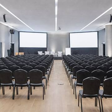 a large room with rows of chairs