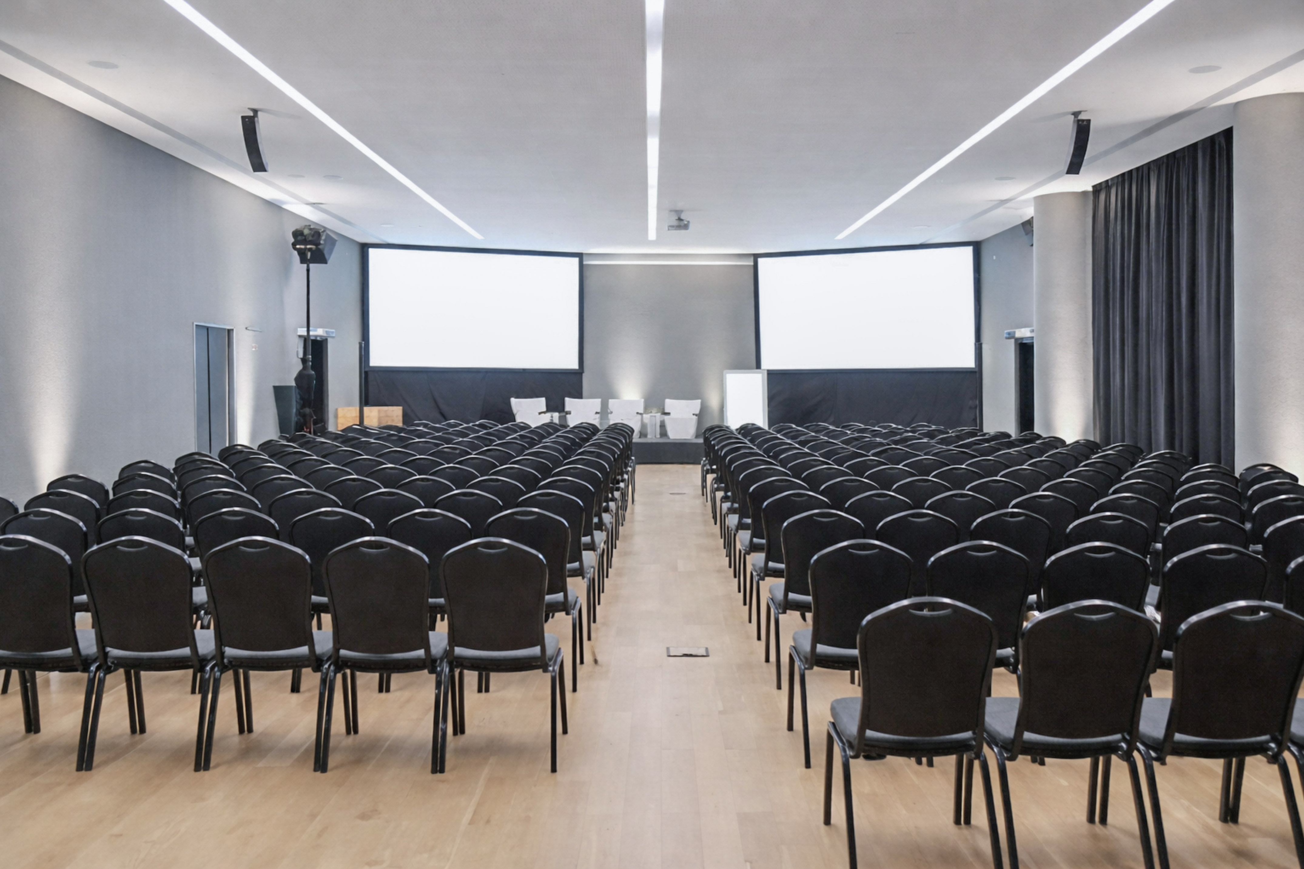 a large room with rows of chairs