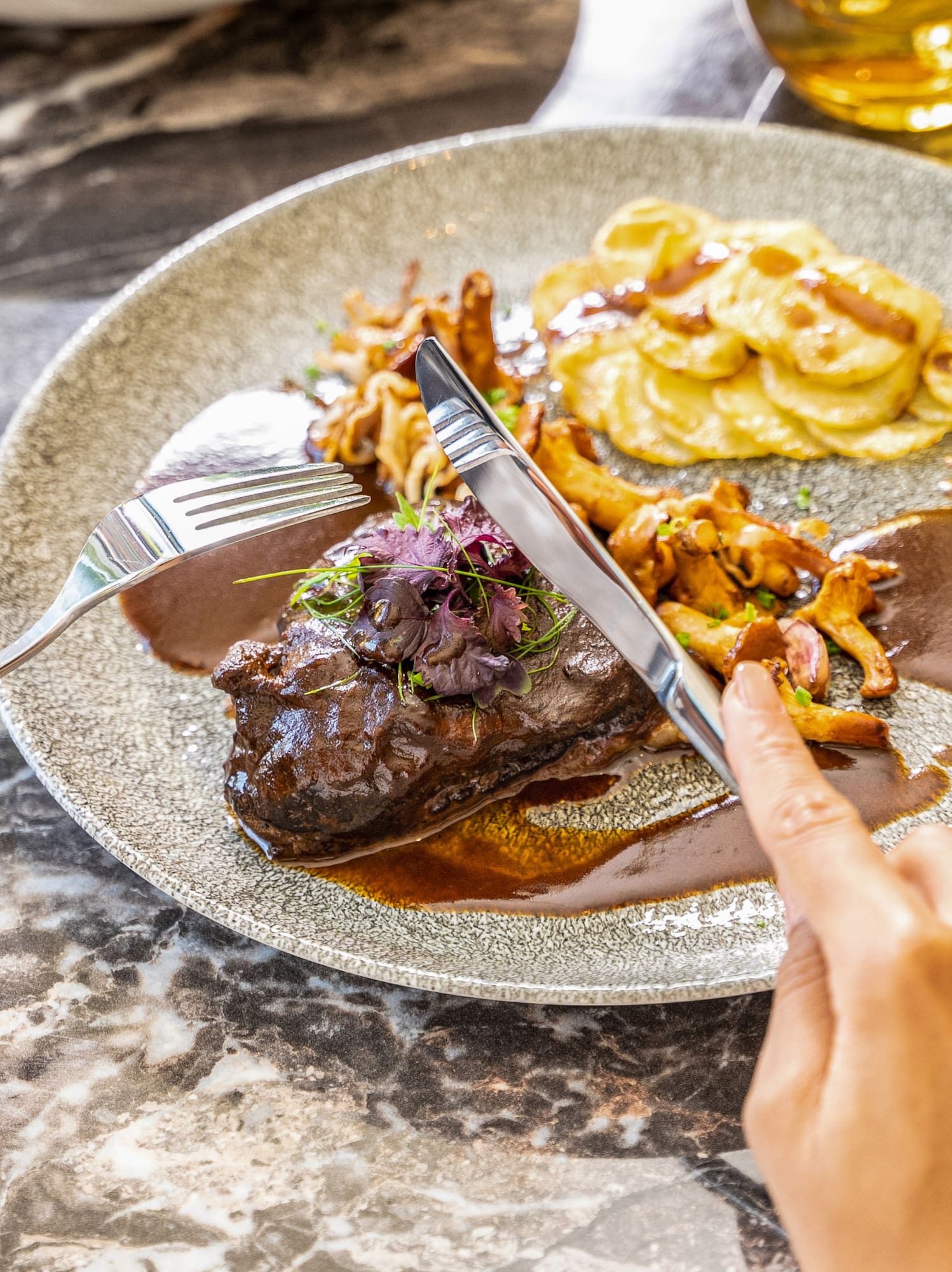a person eating food on a plate