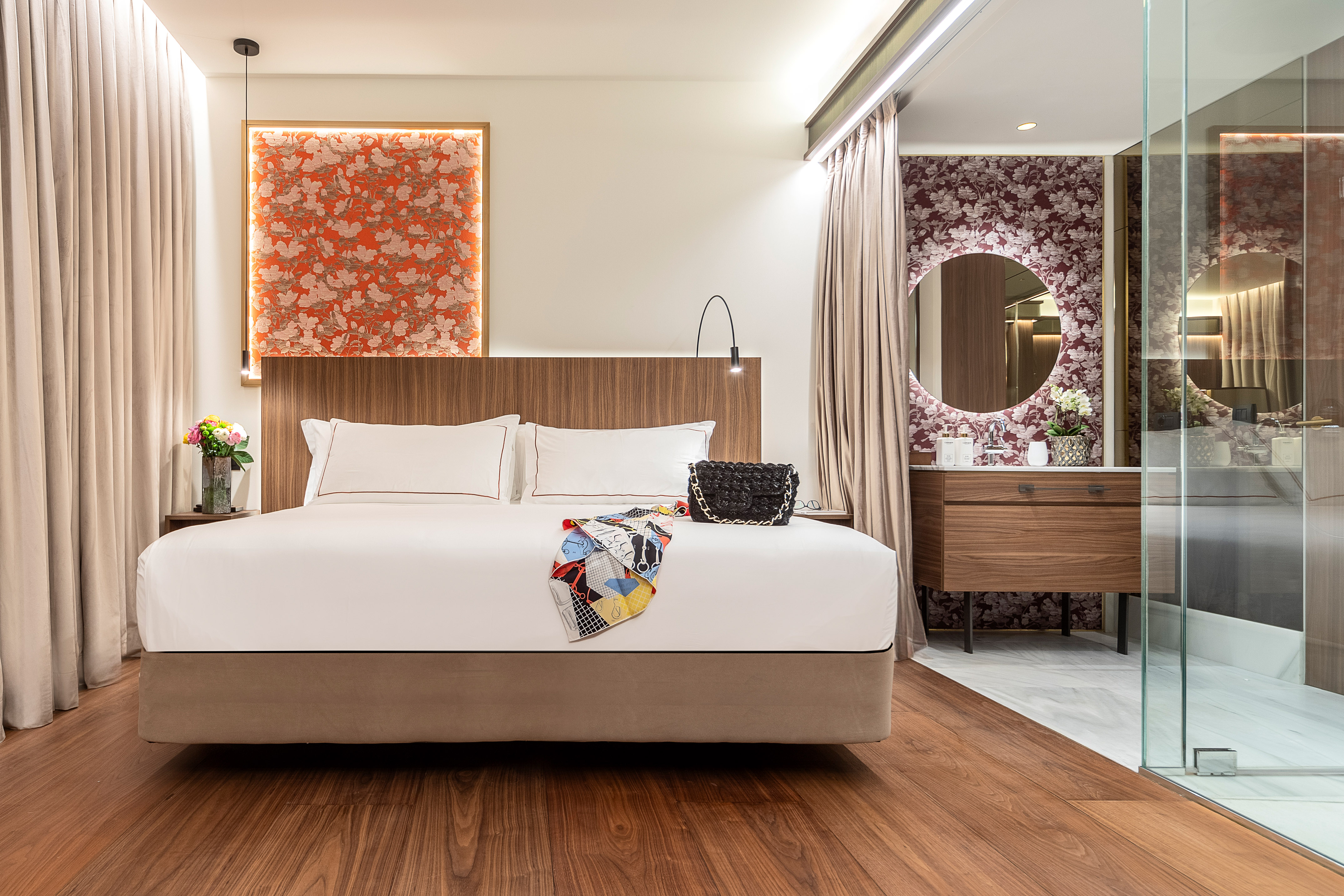 a bedroom with a bed and a mirror