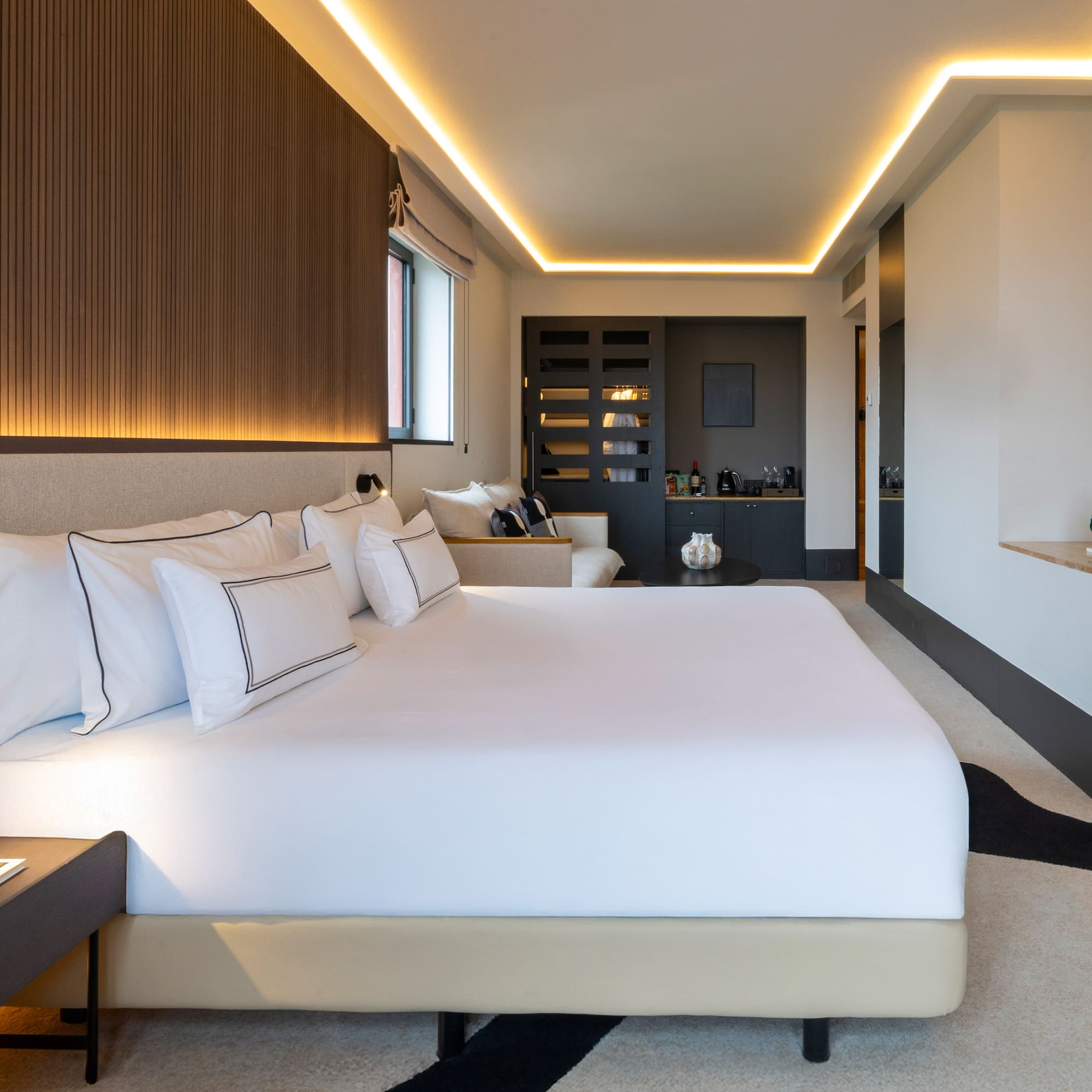 a bedroom with a bed and a counter