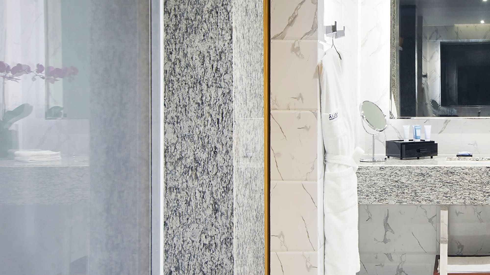 a bathroom with a sink and mirror