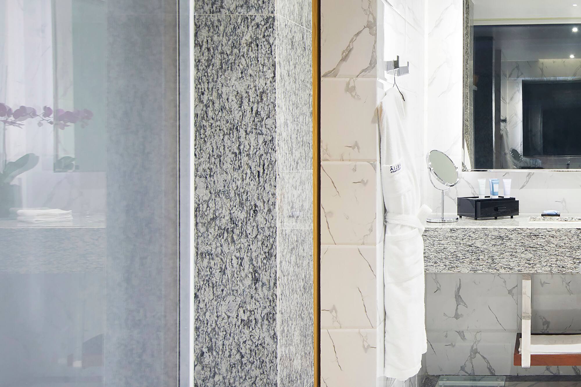 a bathroom with a sink and mirror