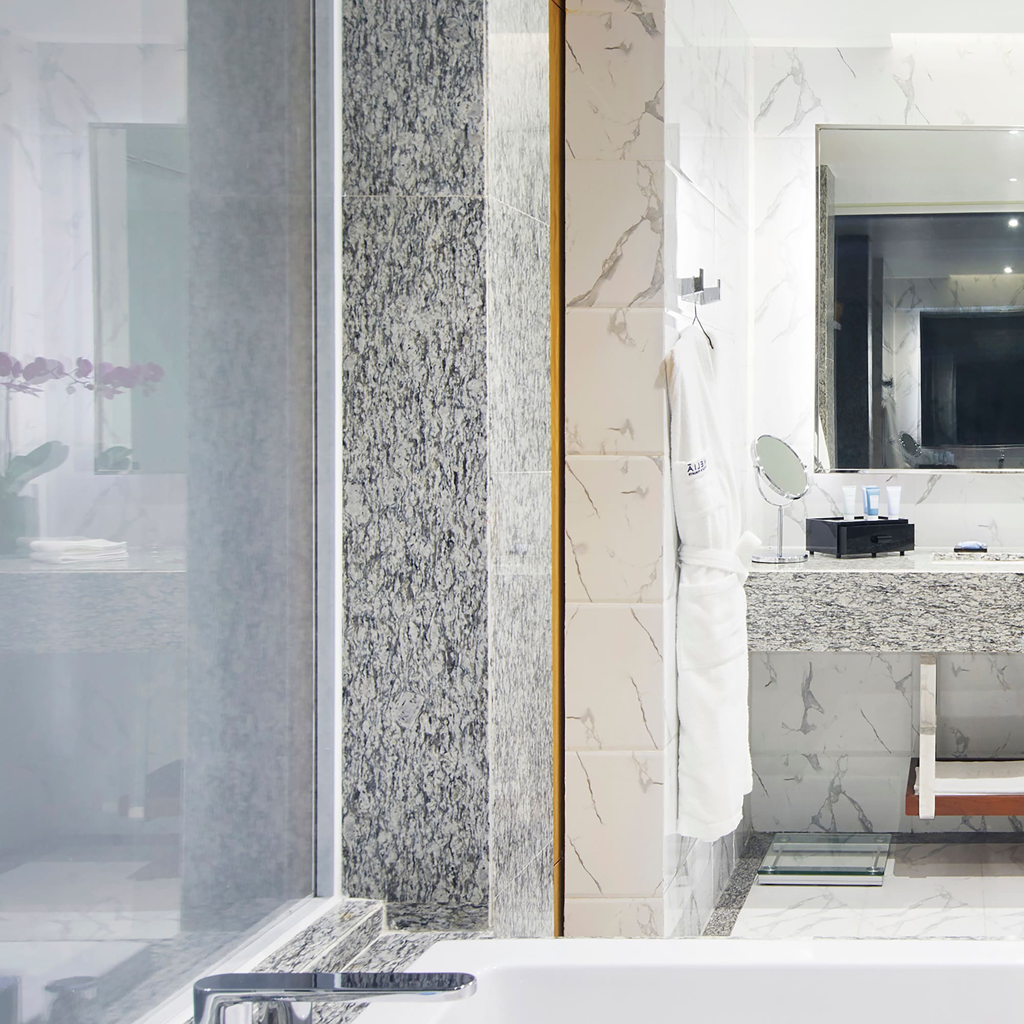 a bathroom with a sink and mirror