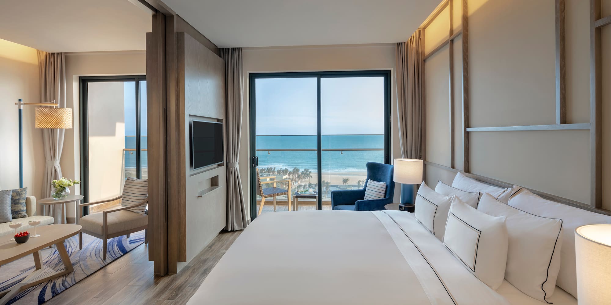 a room with a large bed and a large window