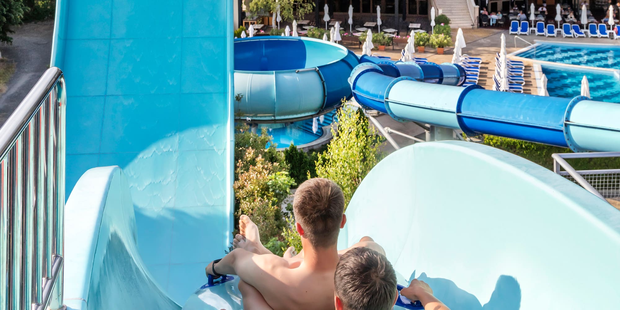 two men on a water slide