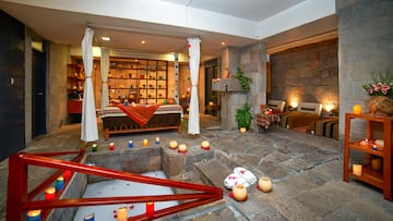 a room with a bed and candles