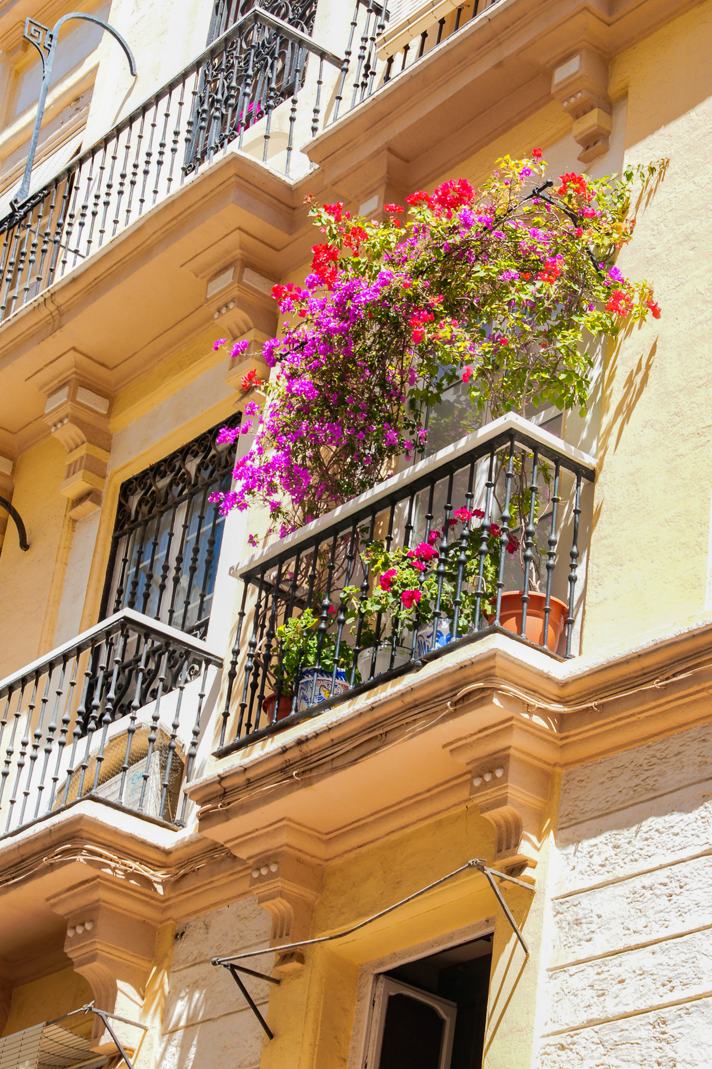 a balcony with flowers on it